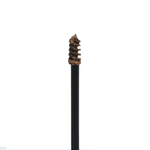 Close-up of Get-Fluffed Brow Gel spoolie with product, ready to tame and tint eyebrows.