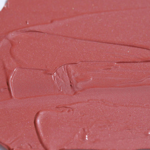 Close-up texture of Candy Paint Cheek + Lip Tint in soft mauve shade, showcasing dewy finish and creamy consistency perfect for radiant skin.
