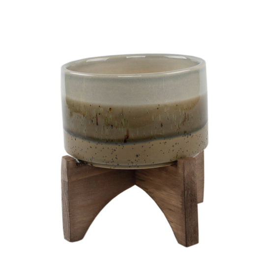 Multi Layered Browns Ceramic Pot On Wood Stand