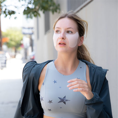 woman wearing protective UV patches