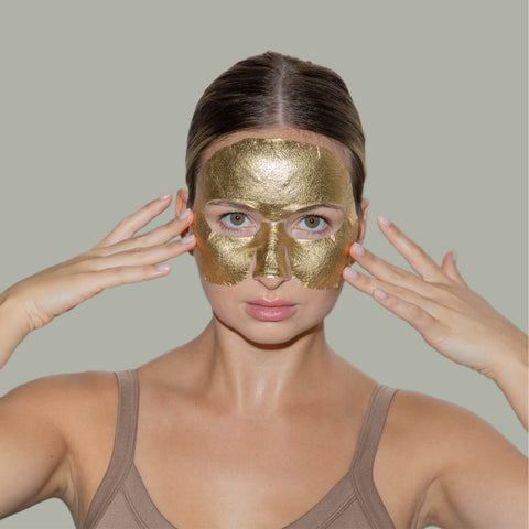 woman wearing gold hydrogel face mask LAPCOS 24K GOLD FOIL COLLAGEN PREMIUM FACIAL SHEET MASK