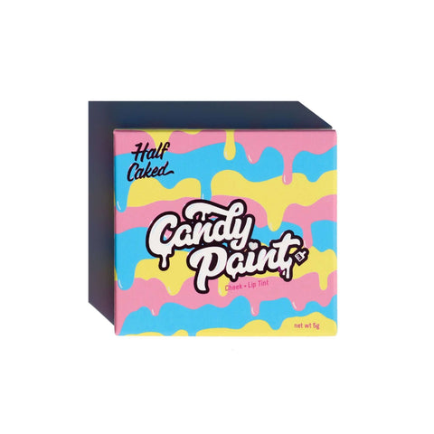 A box of Candy Paint Cream Highlighter with a colorful design, showcasing a heart-shaped compact for dewy, radiant skin.