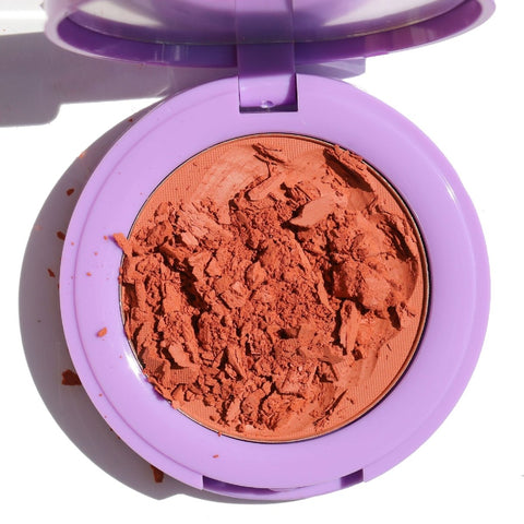 open purple compact with crushed orange blush - In Bloom Powder Blush, liv on sunday - Half Caked