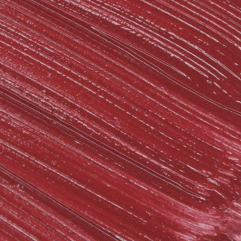 Close-up of Lip Fondant Liquid Lipstick in a vibrant deep red shade with a smooth, glossy texture.