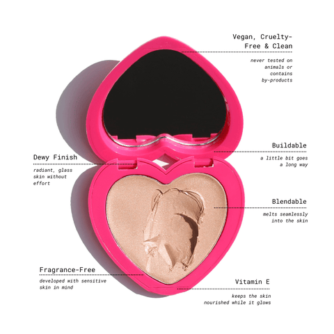 Pink heart-shaped compact housing the Candy Paint Cream Highlighter with an internal mirror, designed for dewy, radiant skin and multi-use application on cheeks, lips, and eyelids.