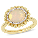 2 CT TGW Yellow Ethiopian Opal and 1/10 CT TW Diamond 14K Yellow Gold Halo Ring