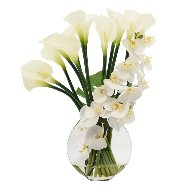 Orchids, Calla Lily and Philodendron Leaves Arranged in a Clear Circular Glass Vase