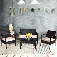 4 Piece Rattan Conversation Furniture Set with Cushioned Seats and Glass Table