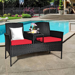 Rattan Cushioned Loveseat with Attached Glass Table